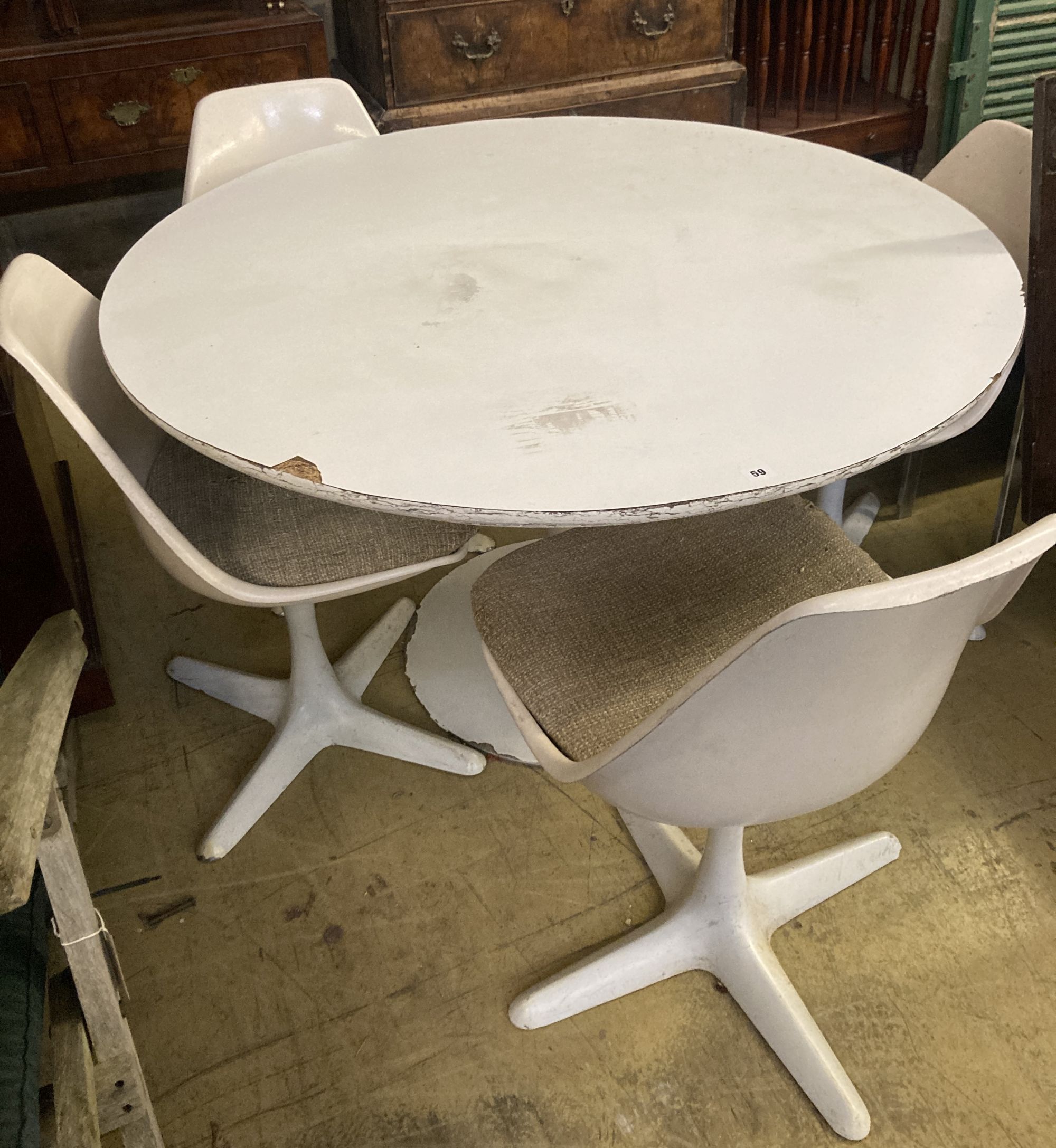 A circular tulip style table and four chairs, table diameter 121cm